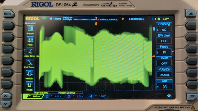 Photo of Rigol DS1054Z oscilloscope screen. The axis scales are 100 mV/division vertically and 1 ms/division horizontally. The signal is 5 divisions tall (500 mV).